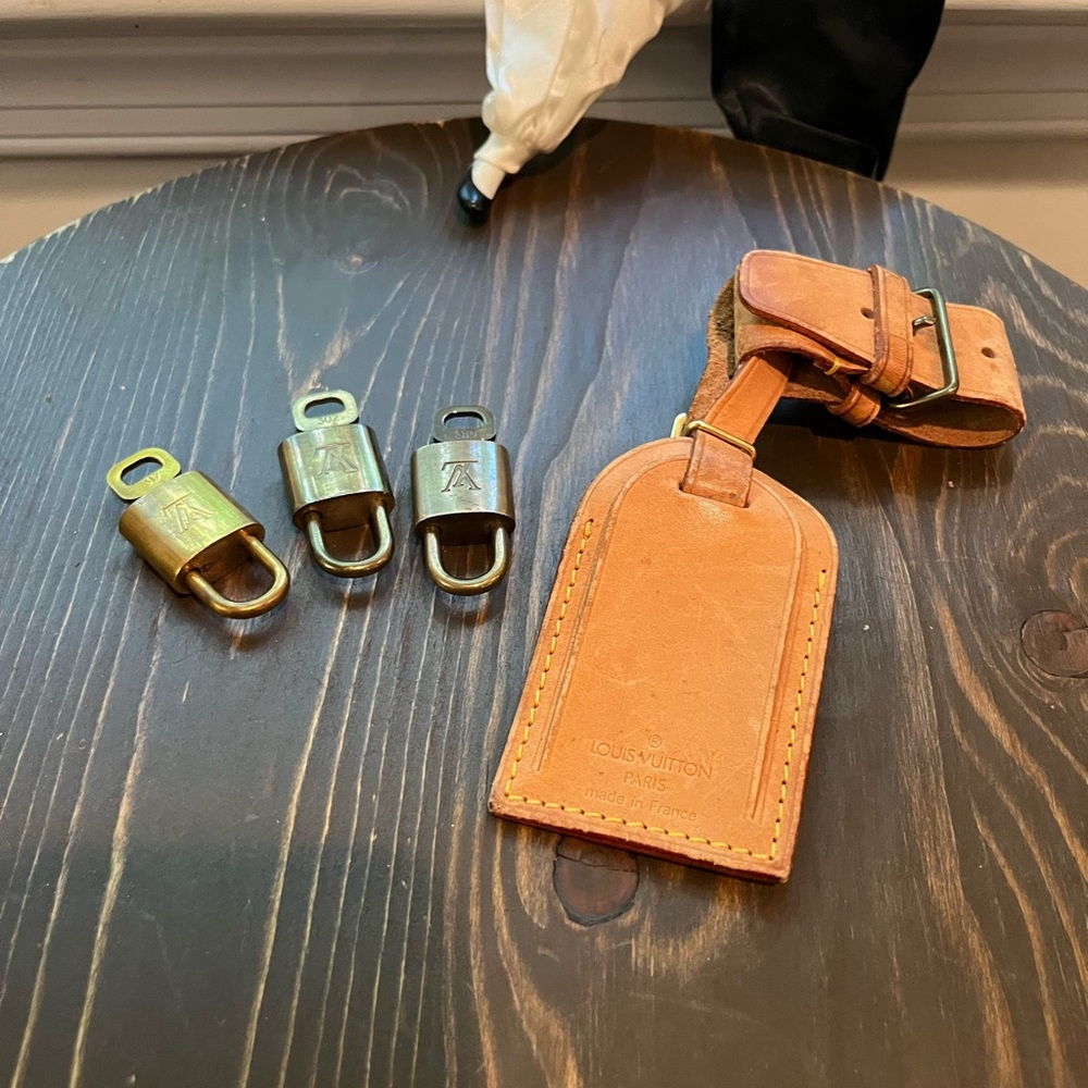 Louis Vuitton Lot ( 3 lock & key sets) & Luggage Tag